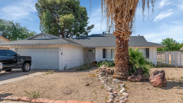4813 W Belmont Ave, Glendale, AZ 85301 - ranch-style home featuring concrete driveway, an attached garage, fence, and a shingled roof
