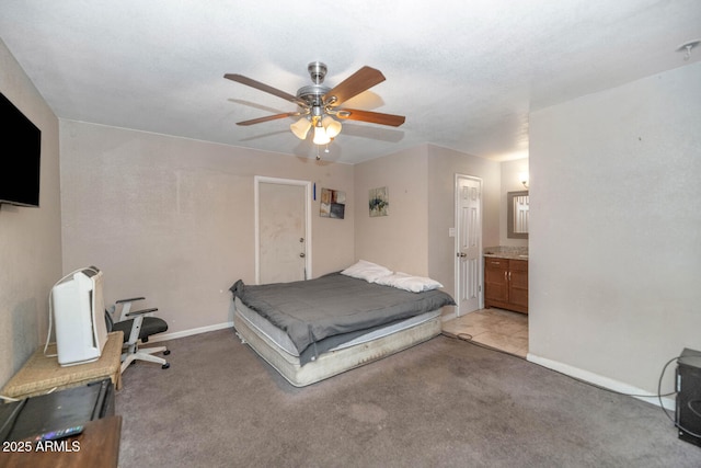 4813 W Belmont Ave, Glendale, AZ 85301 - bedroom with baseboards, light carpet, a ceiling fan, and connected bathroom