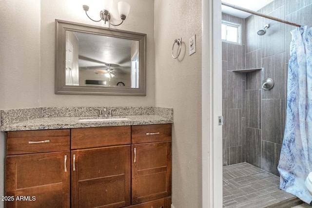 4813 W Belmont Ave, Glendale, AZ 85301 - bathroom featuring vanity, a ceiling fan, and tiled shower