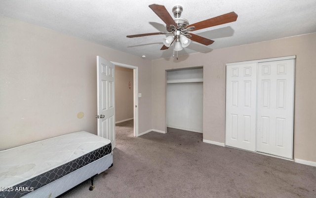 4813 W Belmont Ave, Glendale, AZ 85301 - bedroom featuring baseboards, carpet flooring, multiple closets, and ceiling fan