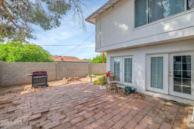 4813 W Belmont Ave, Glendale, AZ 85301 - view of patio with grilling area, fence, and french doors