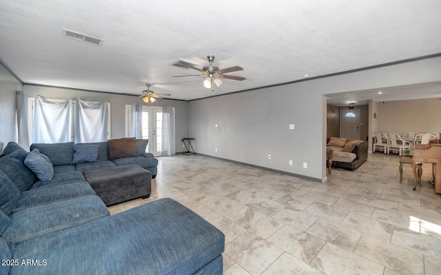 4813 W Belmont Ave, Glendale, AZ 85301 - living area featuring crown molding, a textured ceiling, a ceiling fan, baseboards, and visible vents