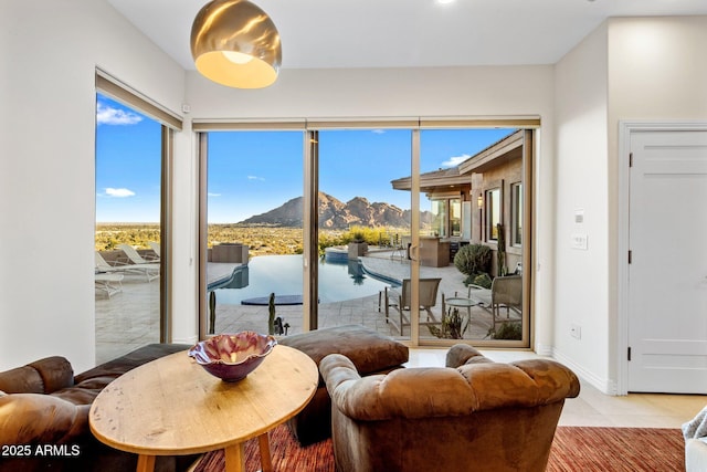 interior space with a mountain view and light tile patterned floors