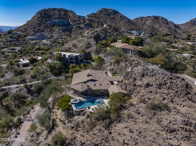 birds eye view of property featuring a mountain view