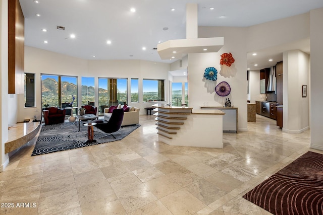 living room with a towering ceiling