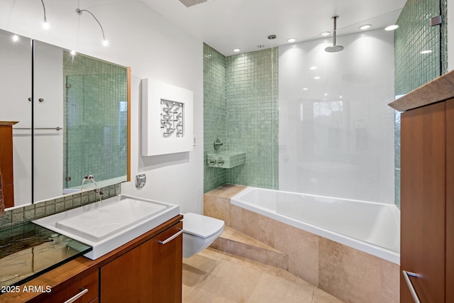 full bathroom with vanity, tile patterned flooring, tiled shower / bath combo, and toilet