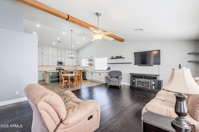 living room featuring vaulted ceiling with beams, dark wood-type flooring, and ceiling fan