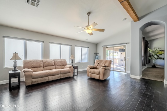 living room with ceiling fan, dark hardwood / wood-style flooring, and lofted ceiling with beams