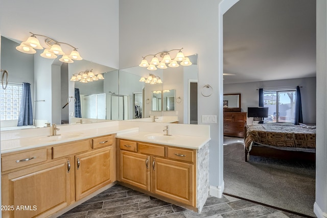 bathroom with vanity and a shower with door