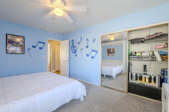 carpeted bedroom with ceiling fan and a closet