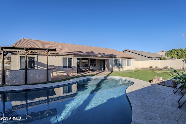 view of swimming pool with a yard and a patio