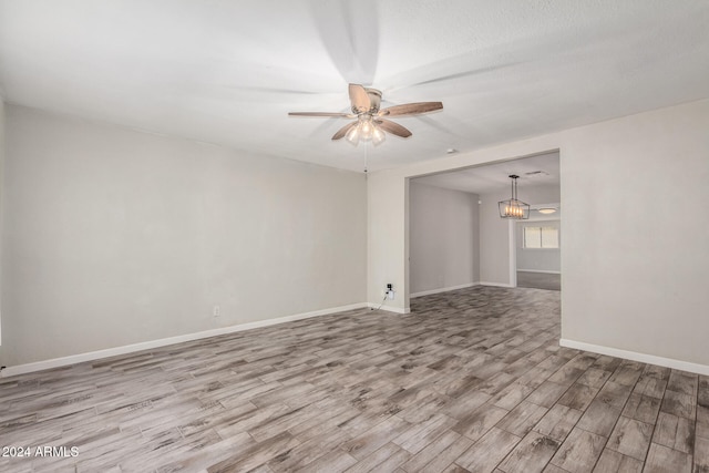 unfurnished room with light hardwood / wood-style floors and ceiling fan