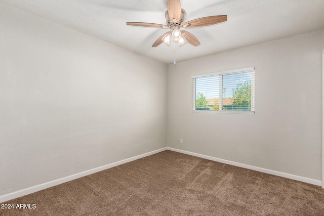 spare room with ceiling fan and carpet floors