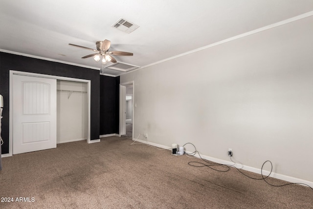 unfurnished bedroom featuring carpet flooring, ceiling fan, a closet, and ornamental molding