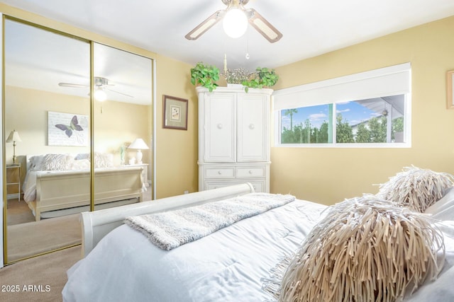 bedroom with a ceiling fan, a closet, and carpet floors