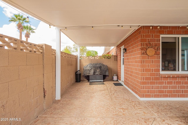 view of patio / terrace featuring area for grilling and a fenced backyard