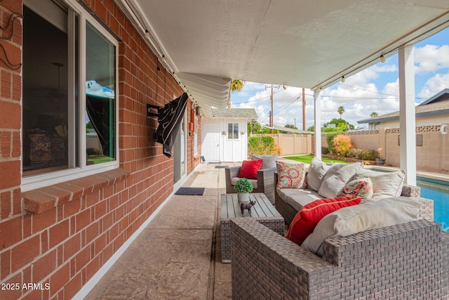 view of patio with a fenced in pool, outdoor lounge area, and a fenced backyard