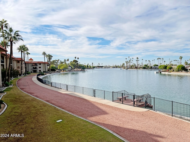 view of community with a water view