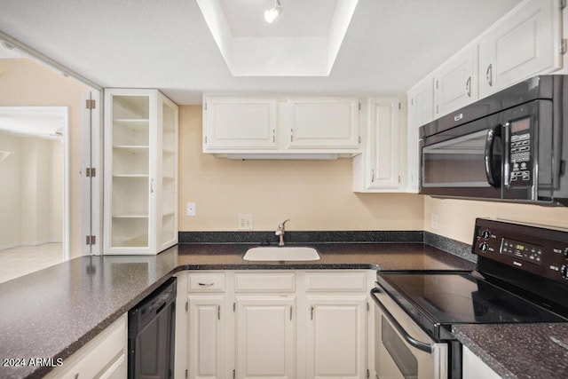 kitchen featuring black appliances, sink, and white cabinets