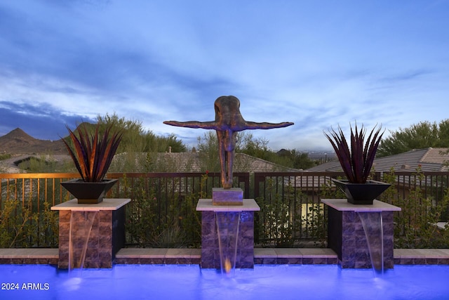 deck featuring pool water feature