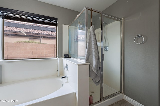 13547 W Peck Dr, Litchfield Park, AZ 85340 - bathroom with a garden tub, a shower stall, and baseboards