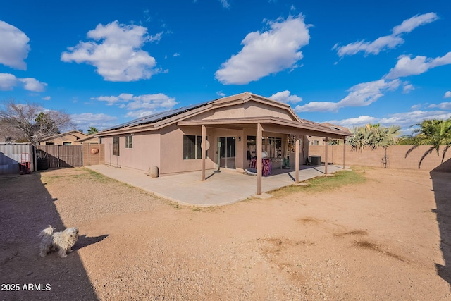 13547 W Peck Dr, Litchfield Park, AZ 85340 - back of property with a patio, a fenced backyard, a gate, and stucco siding