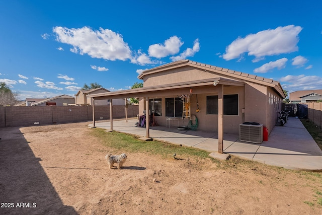 13547 W Peck Dr, Litchfield Park, AZ 85340 - rear view of house featuring a patio area, a fenced backyard, cooling unit, and stucco siding