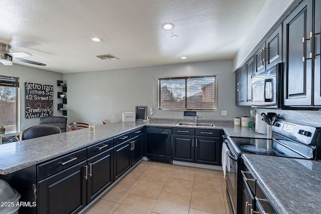 13547 W Peck Dr, Litchfield Park, AZ 85340 - kitchen featuring visible vents, dark cabinets, a peninsula, black appliances, and a sink