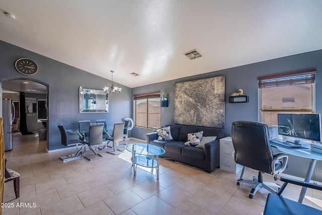 13547 W Peck Dr, Litchfield Park, AZ 85340 - tiled office featuring baseboards, visible vents, arched walkways, vaulted ceiling, and a notable chandelier