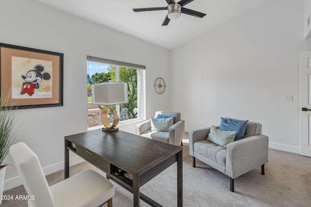 office space featuring light carpet and ceiling fan