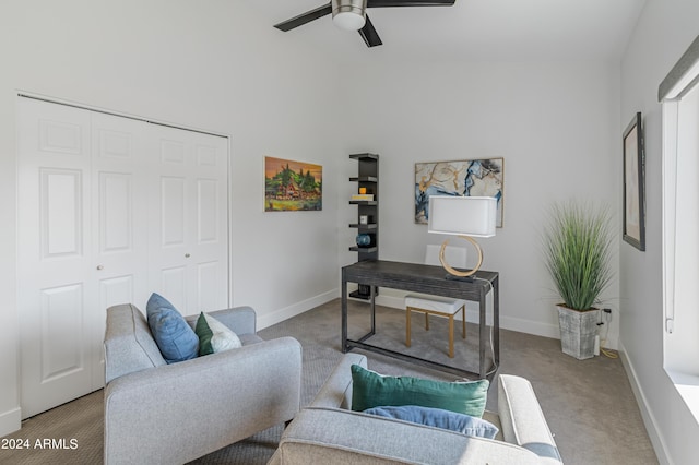 living room with ceiling fan and light carpet