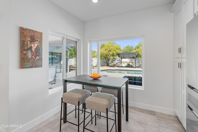 dining area featuring a wealth of natural light