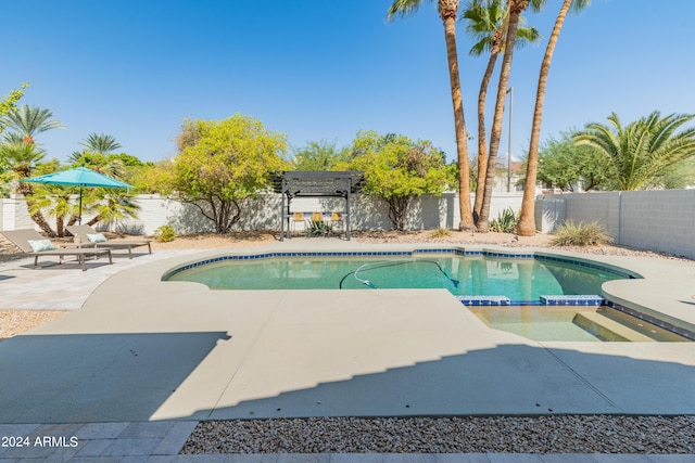 view of swimming pool with a patio, an in ground hot tub, and a pergola