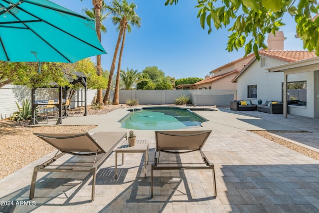 view of swimming pool with an outdoor hangout area and a patio