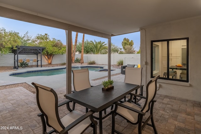 view of patio / terrace featuring a pergola and a fenced in pool