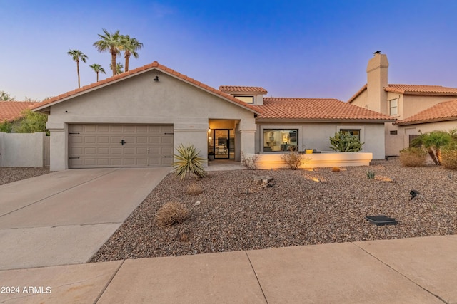 view of front of property with a garage