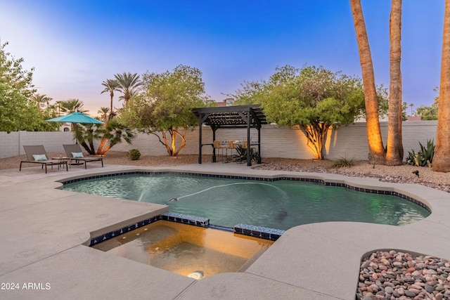 pool at dusk featuring a pergola and a patio