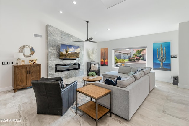 living room featuring vaulted ceiling and ceiling fan