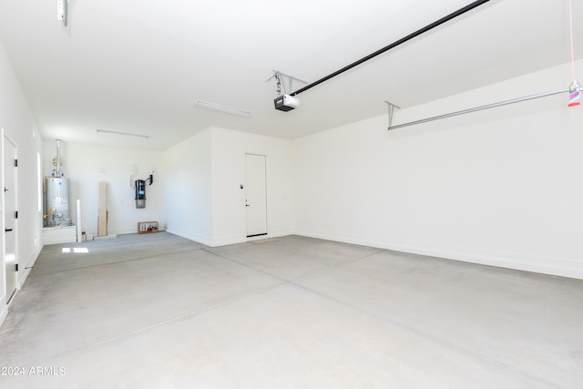 garage featuring gas water heater and a garage door opener