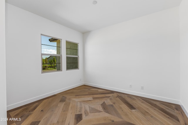 spare room with parquet flooring