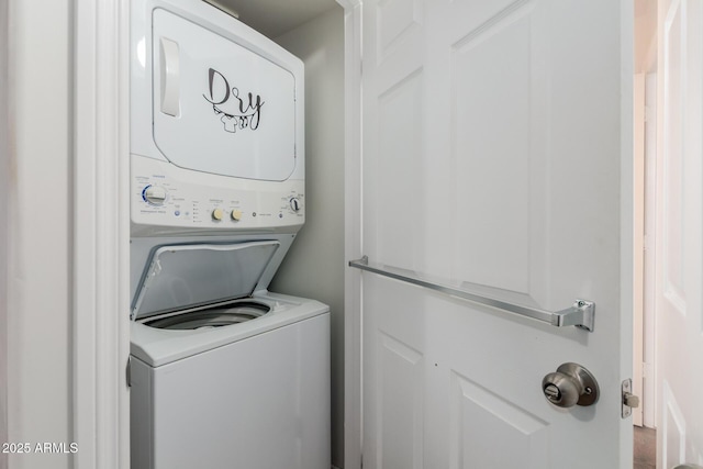 laundry room featuring laundry area and stacked washing maching and dryer