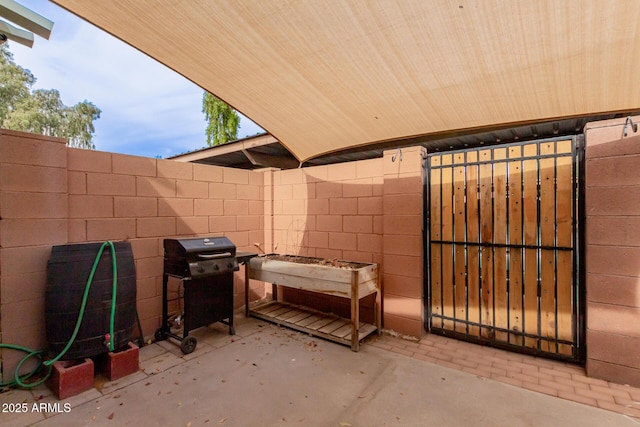 view of patio featuring fence