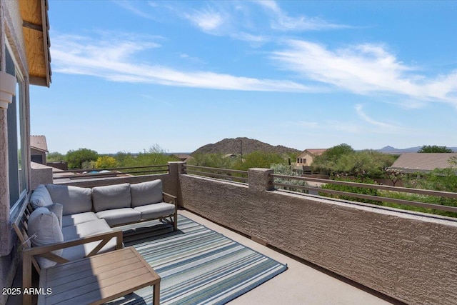 balcony featuring outdoor lounge area and a mountain view