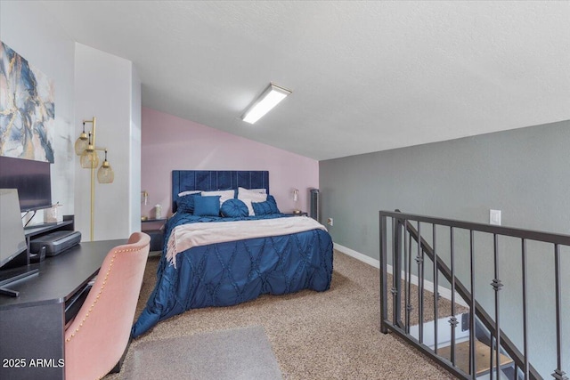 carpeted bedroom with lofted ceiling