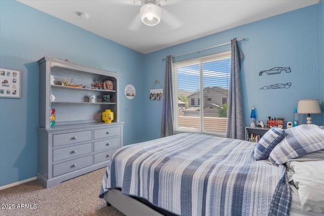 bedroom featuring carpet floors, a ceiling fan, and baseboards