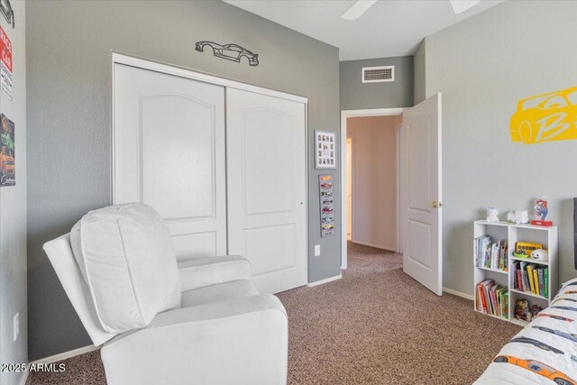 bedroom with baseboards, carpet, a closet, and visible vents