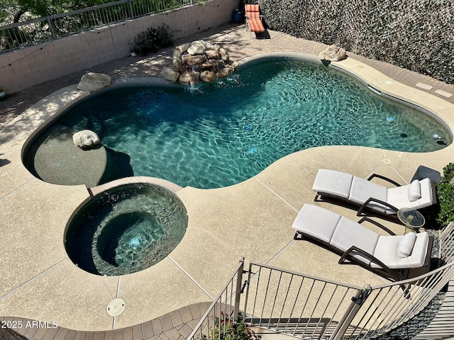 view of swimming pool with a fenced in pool, an in ground hot tub, fence, and a patio