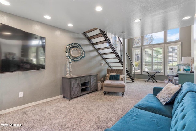 living area with carpet flooring, recessed lighting, baseboards, and stairway