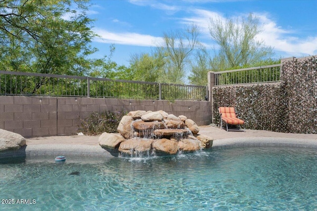 view of pool featuring a fenced in pool and fence