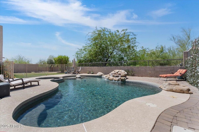 view of pool featuring a fenced in pool, a fenced backyard, and a patio area